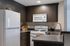 Contemporary kitchen with sleek cabinetry, modern appliances, and elegant countertops.