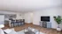 Modern open-concept living room with sleek kitchen, featuring elegant hardwood floors, stylish pendant lighting, and cozy seating area.