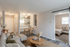 Inviting open-concept living space with cozy lounge, modern kitchen, and a charming bedroom. Perfect blend of comfort and style.