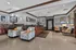 Inviting Park West apartment lobby with elegant seating, modern d&eacute;cor, and warm lighting.