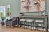 Sleek modern living area with stylish seating, artistic wall decor, and abundant natural light.