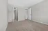Inviting bedroom with plush carpet, pristine walls, and a spacious walk-in closet for maximum storage.