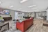 Chic and contemporary lounge area with plush seating, modern decor, and ample natural light, perfect for relaxation and entertainment.