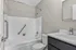 Modern bathroom design with sleek fixtures, elegant bathtub, and stylish vanity for a refreshing oasis.