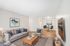 Bright and modern living room with elegant seating, stylish decor, and open dining area perfect for entertaining.