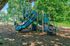 Charming public park playground featuring vibrant climbing structures and slides surrounded by lush greenery.