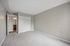 Inviting bedroom with plush carpeting, spacious closet, and elegant en-suite bathroom, perfect for comfort and style.