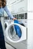 Modern laundry facility featuring efficient front-loading washing machines, perfect for convenient and hassle-free laundry days.