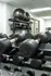 Modern fitness center equipped with a variety of weights and exercise balls, providing a complete workout experience.