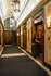 Elegant apartment lobby with vintage elevators and sophisticated lighting, showcasing luxurious marble walls and classic architectural design.