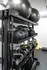 Modern home gym setup featuring sleek kettlebells, medicine balls, and yoga mats neatly organized on stylish black shelving.
