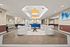 Luxurious apartment lobby featuring elegant beige seating, modern lighting fixtures, and a stylish wooden accent table, creating a welcoming and sophisticated ambiance.