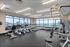 Bright and modern fitness center featuring state-of-the-art exercise equipment and large windows with scenic views.