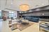 Elegant apartment lobby with modern seating, stylish lighting, and a welcoming atmosphere.