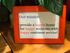 Inspiring framed message emphasizing a mission to provide happy homes and excellent customer service, set against a cozy wooden background with lush green plant accents.