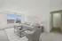 Elegant living room with a large window, modern furniture, and decorative accents.