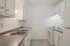 Bright and inviting kitchen with sleek countertops, modern appliances, and ample cabinetry for storage.