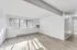 Bright and airy living room with large windows and elegant wooden flooring, perfect for a cozy and inviting atmosphere.