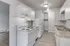 Charming kitchen featuring sleek white cabinetry, modern appliances, and elegant countertops, perfect for culinary creativity.