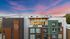 Modern apartment building with sunset backdrop