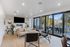 Rooftop clubroom with a TV and modern decor