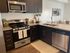 Kitchen with stainless steel appliances and granite counters