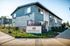 Charming Orange Grove Apartments exterior with lush landscaping and modern architectural design.
