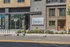 Contemporary apartment entrance with sleek facade and vibrant curbside appeal at The Grant.