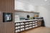 Elegant refreshment area with water dispenser, fresh towels, and a variety of beverages and snacks, perfect for a luxurious lifestyle.