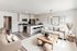 Bright and modern open-concept living space featuring a sleek kitchen with bar seating, cozy sofas, and elegant decor.