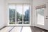 Bright and airy apartment featuring floor-to-ceiling windows with scenic city views and sleek hardwood floors.