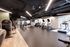 Modern fitness center with state-of-the-art exercise machines, bright lighting, and a sleek, open layout.