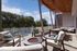 Luxurious balcony featuring modern seating, scenic views, and stylish lighting, perfect for outdoor relaxation.