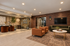 Luxurious modern lounge with elegant seating, stylish wood accents, and chic decor, perfect for relaxation and gatherings.