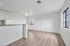 Bright and inviting open-plan living space with modern flooring and ample natural light.