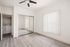 Bright, spacious room with stylish wood flooring, mirrored closet doors, and convenient in-unit laundry. Ceiling fan and large window for natural light.