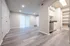 Elegant apartment interior featuring modern vinyl flooring, open-concept living space, and stylish kitchen with stainless steel appliances.