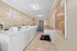 Bright community laundry room featuring modern washing machines and ample folding space.