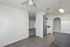 Charming and inviting apartment featuring a modern kitchen with sleek appliances, open living space, and elegant wood flooring.