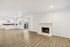 Bright and airy open-concept living space with a cozy white brick fireplace, elegant hardwood floors, and modern kitchen with sleek finishes.