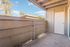 Charming apartment balcony with rustic wood paneling, offering serene views and ample sunshine.