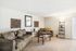 Inviting living room with plush couches, chic decor, and ambient lighting, perfect for relaxation and entertaining.