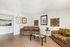 Inviting living room with cozy brown sofas, stylish decor, and natural light, offering a perfect blend of comfort and elegance.