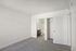 Bright and airy bedroom with plush carpeting, convenient closet space, and an en-suite bathroom.
