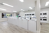 Bright, modern laundry room with multiple washers and dryers, perfect for convenient and efficient laundry days.