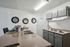 Chic and modern kitchen showcasing sleek countertops, elegant cabinetry, and vibrant decor for a stylish culinary space.