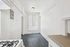 Bright, inviting kitchen with modern gas stove, ample natural light, and sleek countertops, ideal for culinary adventures.