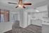 Bright, spacious apartment with sleek kitchen, modern appliances, elegant wood flooring, and inviting open-concept living area.
