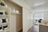 Chic and modern apartment interior showcasing a cozy living area with elegant decor, bright natural light, and a stylish kitchen countertop.