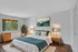 Bright and inviting bedroom with a cozy double bed, stylish decor, and lush greenery, perfect for relaxation.